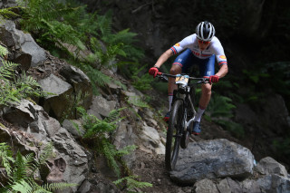 Corran Carrick-Anderson riding over rocks at the world championships in Scotland