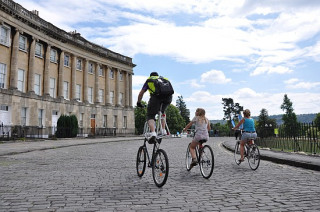 Cyclists passing the Royal Crescent during Sky Ride 2010