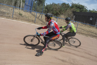 Men's Cycle Speedway Battle of Britain & Elite GP Round 3, Ipswich - North and Scotland in action shot rounding a corner with South East and Eastern.