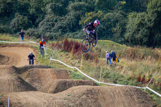 National 4X series in Witcombe - riders in mid jump over track.