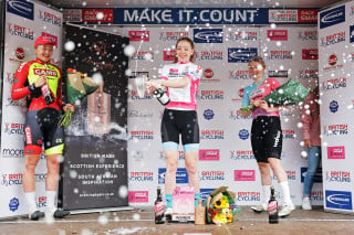 Women's National Road Series podium shot with champagne spray