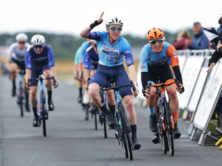Three-day Manx Telecom International on the Isle of Man, male riders crossing finish line.