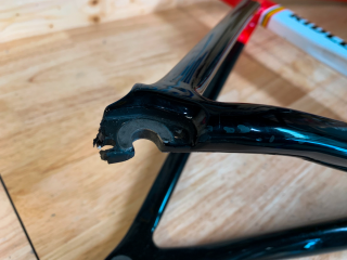 A chipped carbon fibre bike frame