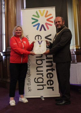 Image of Pauline receiving her Inspiring Volunteer award from the Edinburgh Lord Provost