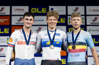 Will Tidbal wearing a silver medal on the podium at the 2024 Track Elite European Championships in Apeldoorn, Netherlands.