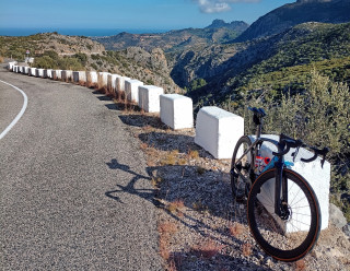 Will Perrett's bike leaning against a barrier on a road in Tenerife