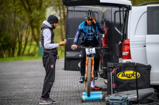 A mountain bike rider warming up on the rollers