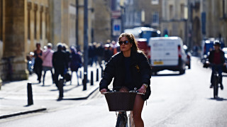 A women cycling in Cambridge