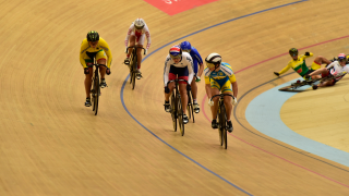 Katie Marchant in the UEC European Track Championships keirin, while teammate Victoria Williamson crashes