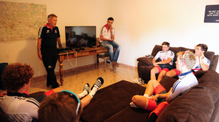 Brian Stephens and David Millar hold a meeting with the academy riders at the house