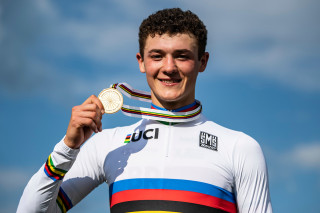 Charlie Aldridge with his winners medal and rainbow jersey at the 2019 UCI Mountain Bike World Championships in Mont-Saint-Anne, Canada.