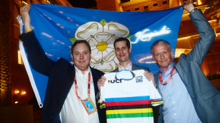 British Cycling president Bob Howden, UK Sport's Simon Morton and British Cycling's director of cycling Jonny Clay celebrate the awarding of the 2019 UCI Road World Championships to Yorkshire