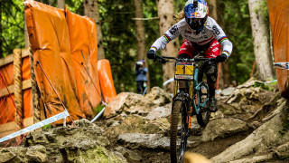 Britainâ€™s Rachel Atherton made history as she won a tenth successive UCI Mountain Bike Downhill World Cup with victory in Leogang on Sunday.