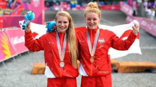 Team England's Annie Last and Evie Richards celebrate winning gold and silver in the mountain bike at the 2018 Commonwealth Games