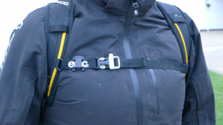 A rucksack strap which features a whistle for use in emergencies