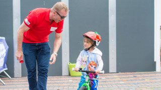 Sir Chris Hoy with a young rider at HSBC UK City Ride in Birmingham