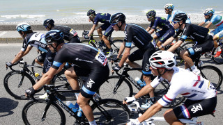 Chris Froome surrounded by Team Sky on the road to Le Havre