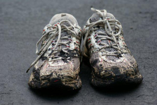 Image of muddy running shoes