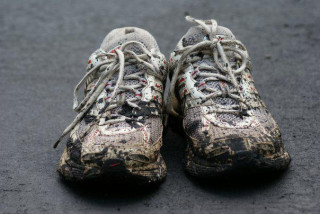 Image of muddy running shoes