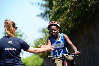 A volunteer supporting a Go-Ride session