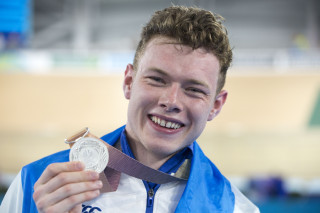 Jack Carlin with his silver medal